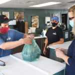 marios fishbowl in westover prepares order